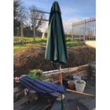 Two garden umbrellas, one blue, one green and bases