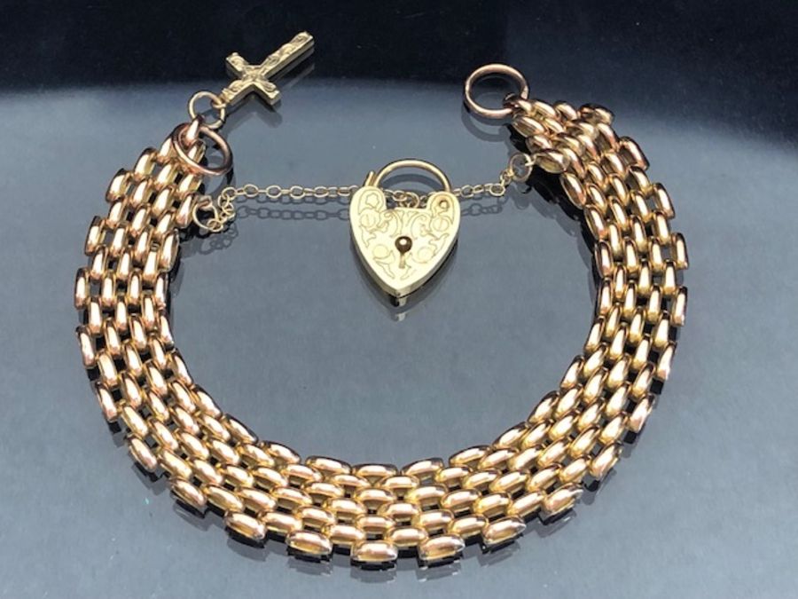9ct Gold gate link Bracelet with 9ct Gold heart and cross with safety chain, alternate four three