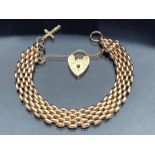 9ct Gold gate link Bracelet with 9ct Gold heart and cross with safety chain, alternate four three