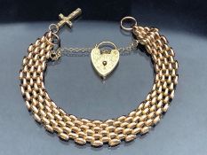 9ct Gold gate link Bracelet with 9ct Gold heart and cross with safety chain, alternate four three