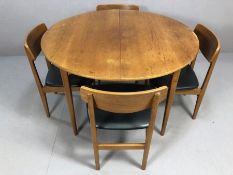 Mid century teak extending dining table by Nathan accompanied by four teak dining chairs with