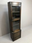 Mid Century sectional bookcase or display case with cupboard under and two glass fronted sections,