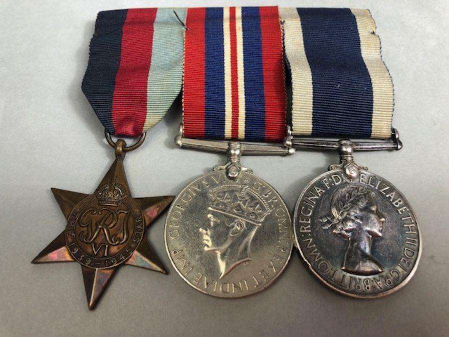 Medals: WWII Group of Navy Medals awarded to MX 61191 E. G. Munday. S. C. P. O. (V). HMS DRAKE To