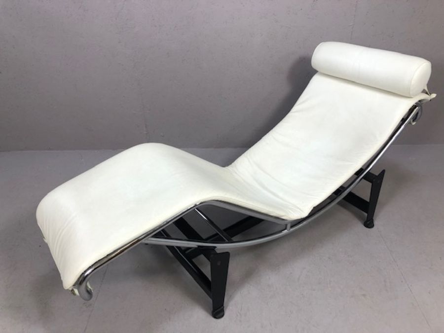 After Le Corbusier - ‘LC4’ adjustable chaise longue, white seat cushion and pillow over tubular