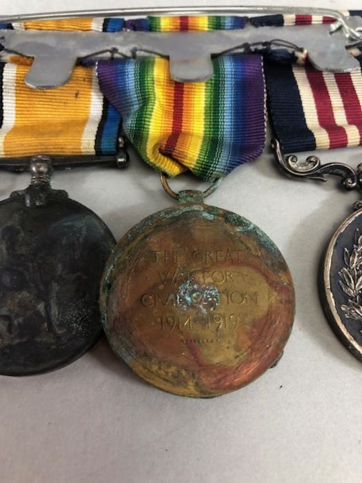 Medals: Collection of four WWI medals, trio of medals plus the George V FOR BRAVERY IN THE FIELD - Image 10 of 16