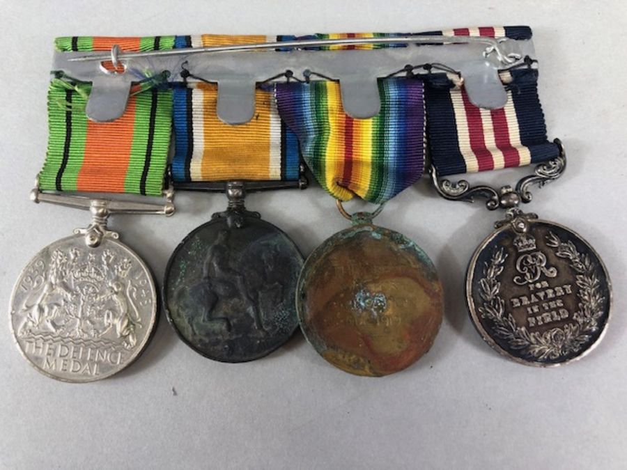 Medals: Collection of four WWI medals, trio of medals plus the George V FOR BRAVERY IN THE FIELD - Image 7 of 16
