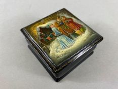 Russian lacquered Box, by Fedoskino, depicting characters in a winter scene approx 7 x 7x 3.5cm