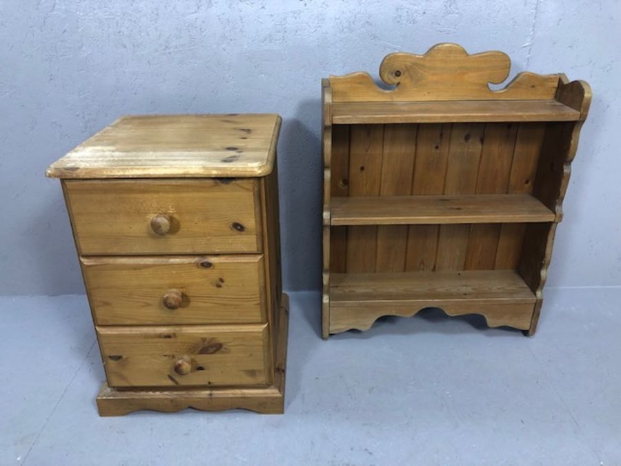 Single pine three drawer bedside and a small pine carved bookshelf