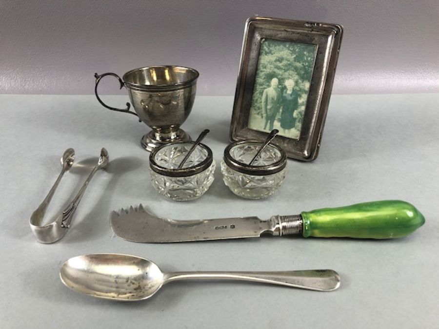 Collection of silver hallmarked items to include a silver photo frame, Silver cup, flatware and