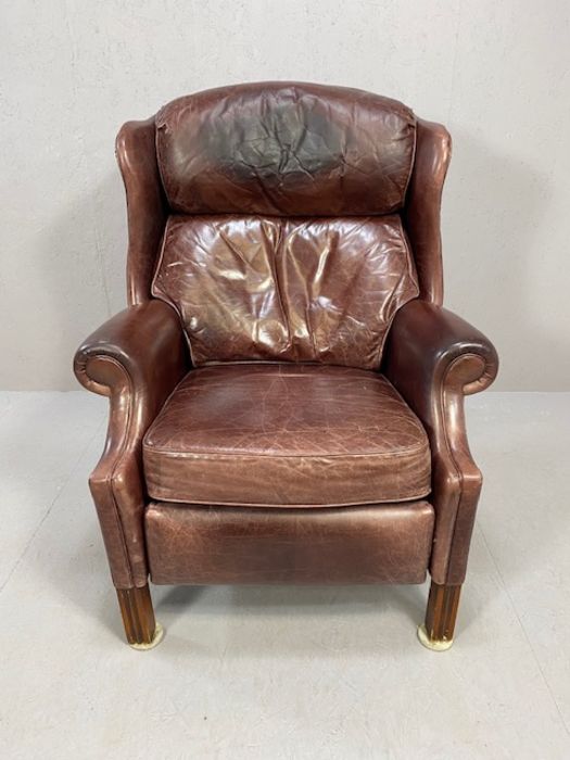 Red leather reclining club style armchair, with studded detail