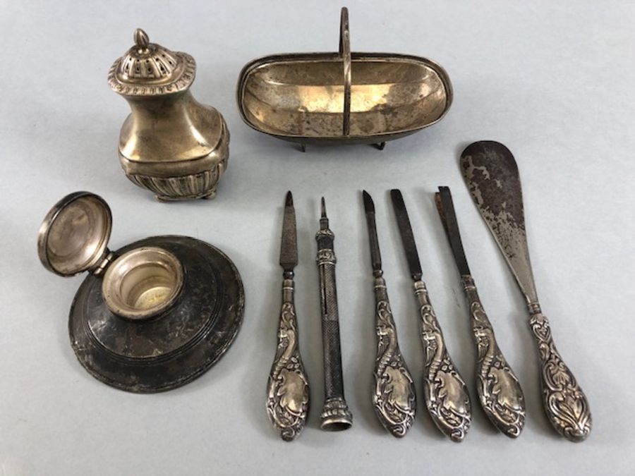 Collection of hallmarked silver items to include a silver basket, inkwell, propelling pencil and a