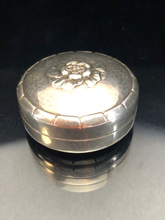 Georg Jensen silver pill box model 79D stamps to reverse with flower motif approx 36mm in diameter