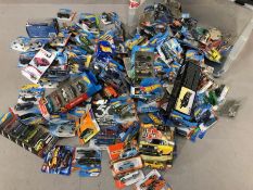 Large collection of Hotwheels cars, boxed, along with two display shelves