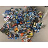 Large collection of Hotwheels cars, boxed, along with two display shelves
