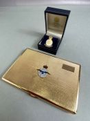 Gold Coloured cigarette case with the emblem and official motto of the RAF "Per Ardva Ad Astra"