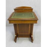 Davenport desk by Maple & Co with green leather writing slope, on castors, with key. Approx 53cm x