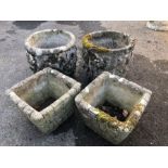 Two pairs of concrete garden pots