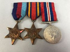 Medals: 1939 -45 Star, Burma Star and war medal with ribbons on bar