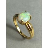 18ct Gold ring set with a cushion cut Opal approx 7mm x 9mm in a four claw setting size approx 'N' &