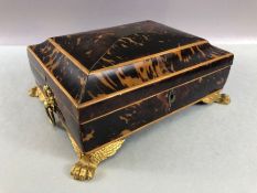 Jewellery box in tortoise shell on gilt lion paw feet with two gold gilt ring handles and lined in