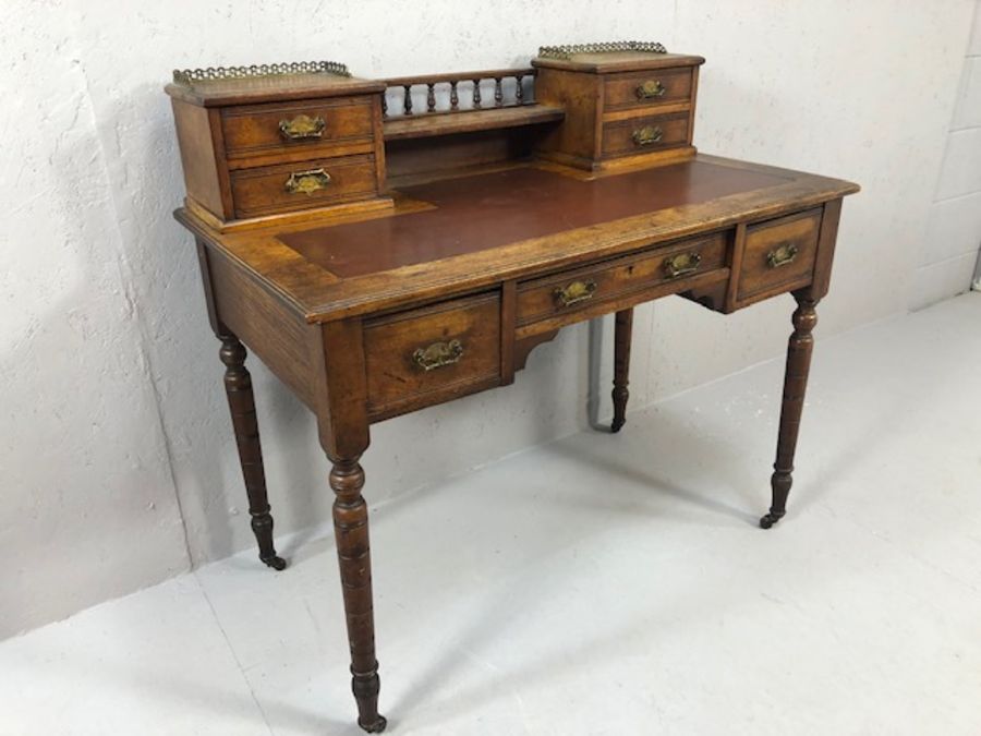 Antique writing desk on turned legs and castors with burgundy leather insert and gallery with - Image 2 of 17