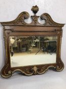 Antique bevel edged mirror in substantial wooden and gilt frame, with swan neck pediment and gilt