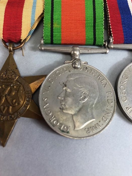 Medals: WWII medal set comprising Africa Star, Defence medal, War medal and 1939-45 star with bar - Image 4 of 8