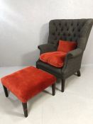 Contemporary Tetrad Harris Tweed wingback armchair, with contrasting red velvet upholstered seat and