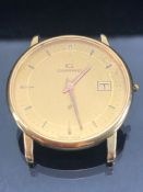 18ct Gold wristwatch Quartz movement by Garrard, gold coloured dial, date aperture at 3 o'clock