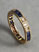 Yellow Gold Eternity ring set with alternate sets of three Diamonds and three square cut sapphires