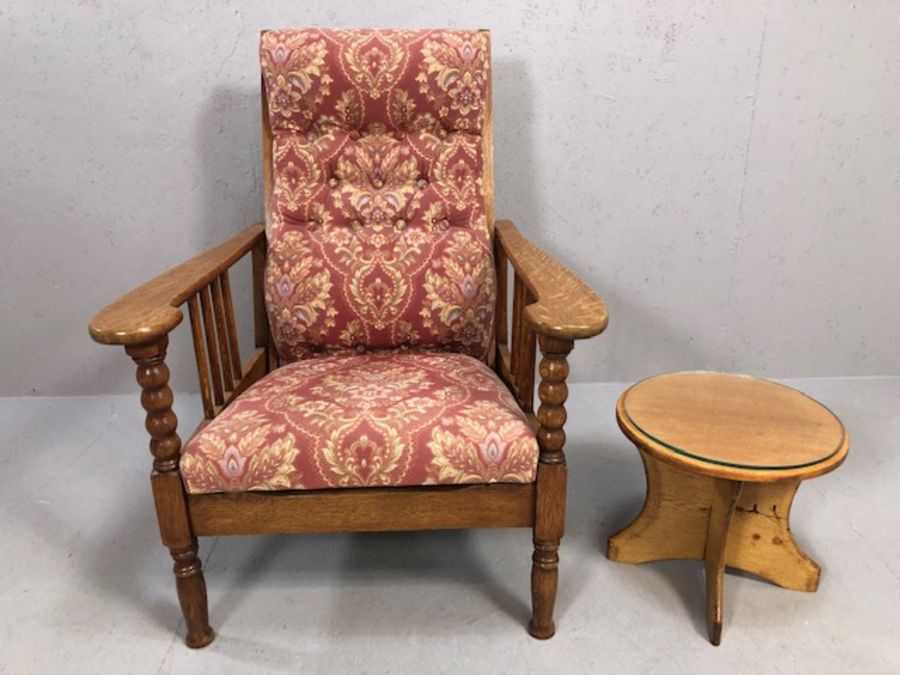 Vintage oak framed reclining and upholstered armchair with circular side table