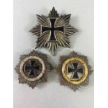 Militaria: Three German style Medals, two with makers marks L/21, Star Of The Garnd Cross and 2 *