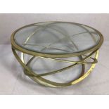 Contemporary glass-topped coffee table on gilt metal base formed by concentric circles, approx