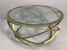 Contemporary glass-topped coffee table on gilt metal base formed by concentric circles, approx