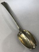 Solid Silver large straining spoon hallmarked for London, crest of a stag crown and cross dated 1774