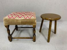 Two small vintage wooden stools, one with padded seat