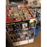 Large collection of posters in their original packaging with display boxes and signs