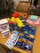 Collection of various childrens toys to include pink pig money banks, water bottles, water bombs,
