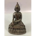 Bronze Buddha or eastern Deity seated with hand touching the ground, approx 13cm tall and hollow