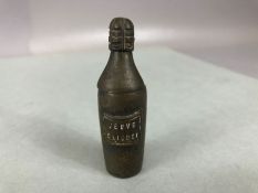 Advertising - an early 20th century metal miniature novelty vesta case, in the form of a bottle of