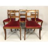 Five dining room chairs with red velvet seat pads