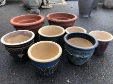 Collection of eight terracotta garden pots