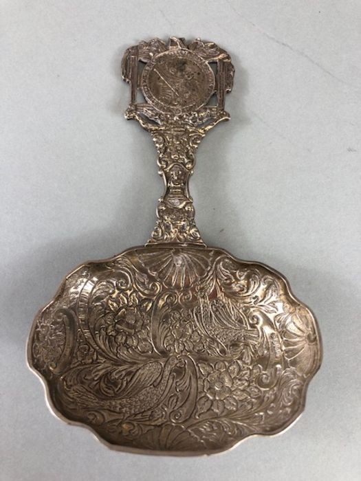 Silver hallmarked ornate (possibly caddy) spoon the handle set with a Silver coin hallmarked for