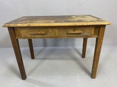 Oak desk with two drawers, wooden handles and square legs, approx 107cm x 61cm x 77cm