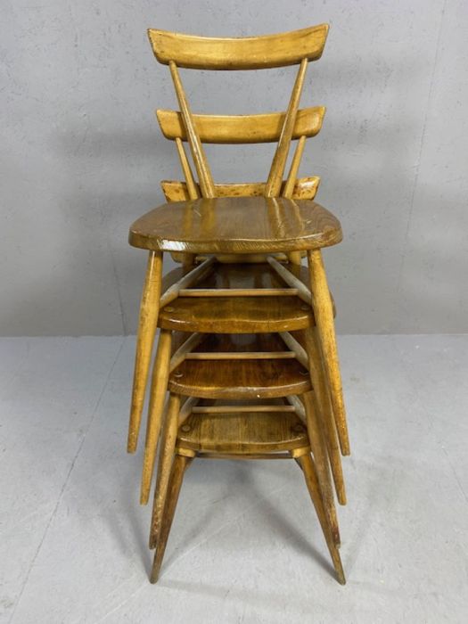 Set of four early Ercol tapered, stick back stacking chairs