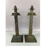 Pair of interesting brass candlesticks with detachable acorn finials on square stepped bases