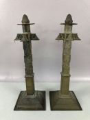 Pair of interesting brass candlesticks with detachable acorn finials on square stepped bases