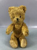 Small antique teddy bear with articulated joints, approx 23cm in height