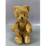 Small antique teddy bear with articulated joints, approx 23cm in height