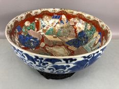 Large Chinese bowl with blue character mark to base, blue and white floral patterns to exterior,